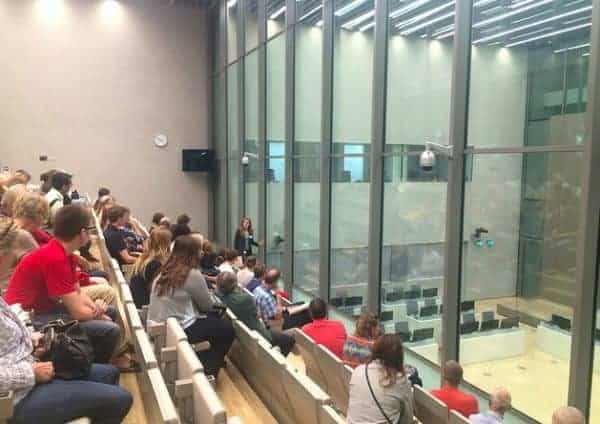 Visitors to the ICC on Sept. 25, 2016, in a public gallery overlooking a courtroom. ICC-CPI
